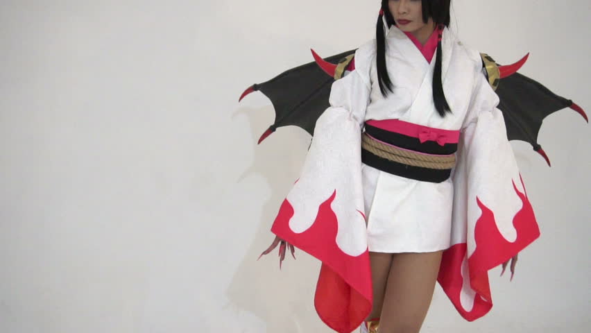 Portrait of beautiful asian girl wear cosplay game animation on white background,Thailand people,Red cloths devil style
