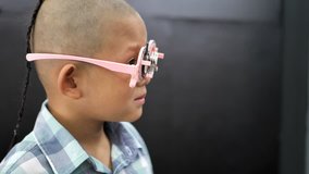 eyesight check. Asian boys who have vision disabilities. Left eye is not visible from brain surgery. Medical treatment and Rehabilitation. video 4k
