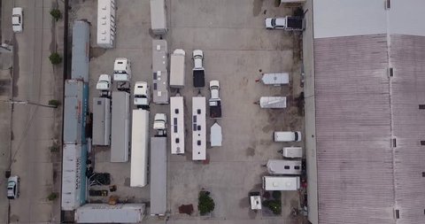 Aerial Parking Lot with Film Trucks and Trailers