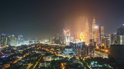4k UHD time lapse of sunrise night to day at Kuala Lumpur city skyline horizon. 