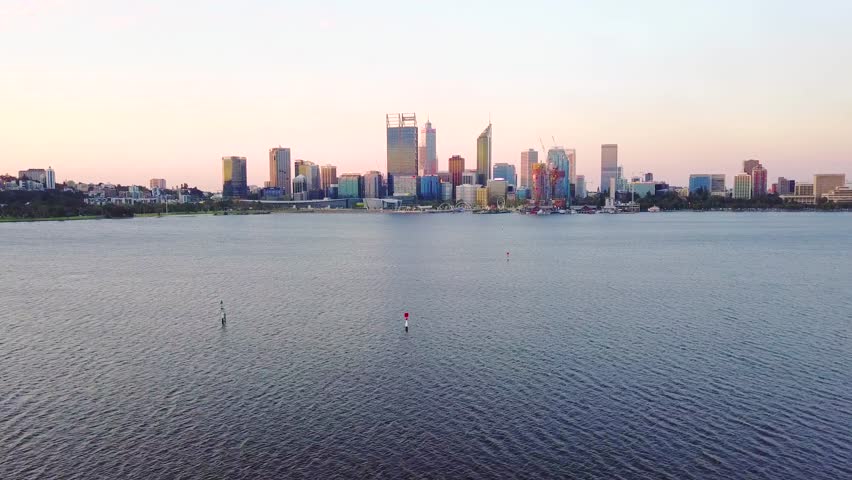 Aerial video over the Swan River and Perth city skyline. Perth, Western Australia.