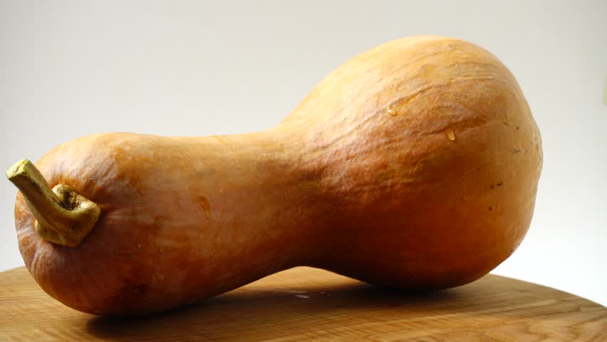 Shooting of pumpkin on cutting board.