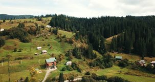 Aerial drone footage of highland town in Carpathian mountains.Beautiful nature of Southern Europe.Travel destination for active tourism in Western Ukraine.Small city surrounded with Carpathians