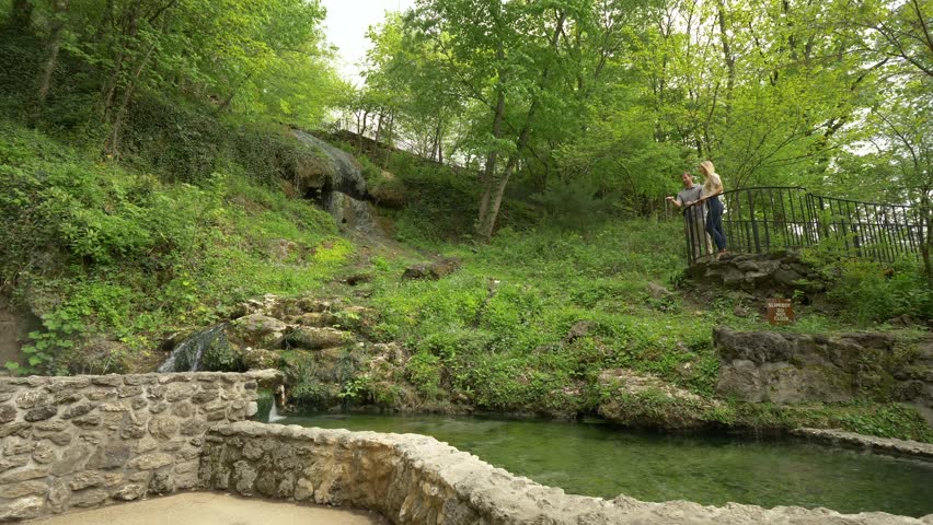 Couple Overlooking Beautiful Pond and Hills in Midwestern Park, Slow Motion