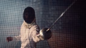 Duel, battle of two fencing athletes . Shot of the camera from inside the fencing mask . Two Professional Fencers Show Masterful Swordsmanship . Shot on ARRI ALEXA cinema camera . - Powered by Shutterstock - Get 15% off with code: PIKWIZARD15