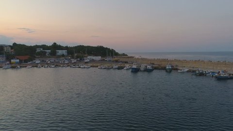 Fisherman Boats and lighthouse Aerial Low fly at Sunset ,in Carevo,Bulgaria