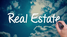 Real Estate - cloud with a blue sky. Man Hand writing with black marker on the sky. Amazing Time Lapse blue sky clouds and sun shining. Big dreams, hopes and aspirations. 4k - Powered by Shutterstock - Get 15% off with code: PIKWIZARD15