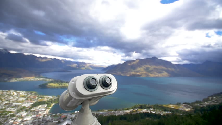 Viewpoint binoculars overlooking Queenstown town in New Zealand.