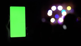 Smartphone greenscreen concert crowd background technology chromakey lights lanterns bokeh blurred 4k