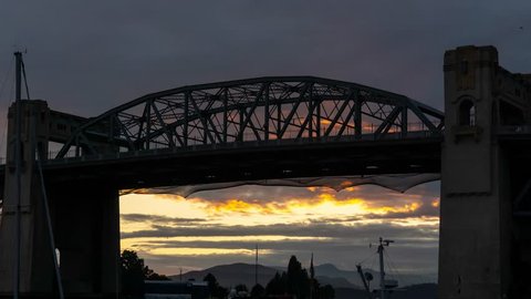 Cloudy Sunset Timelapse of Burrard Bridge in False Creek, Downtown Vancouver, BC, Canada.