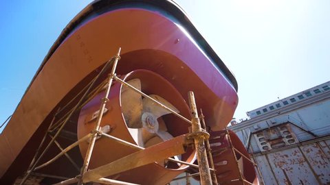 Ship Under Repair in Floating Dock . Overhaul and Modernization of Ships . View of the Repaired Propeller