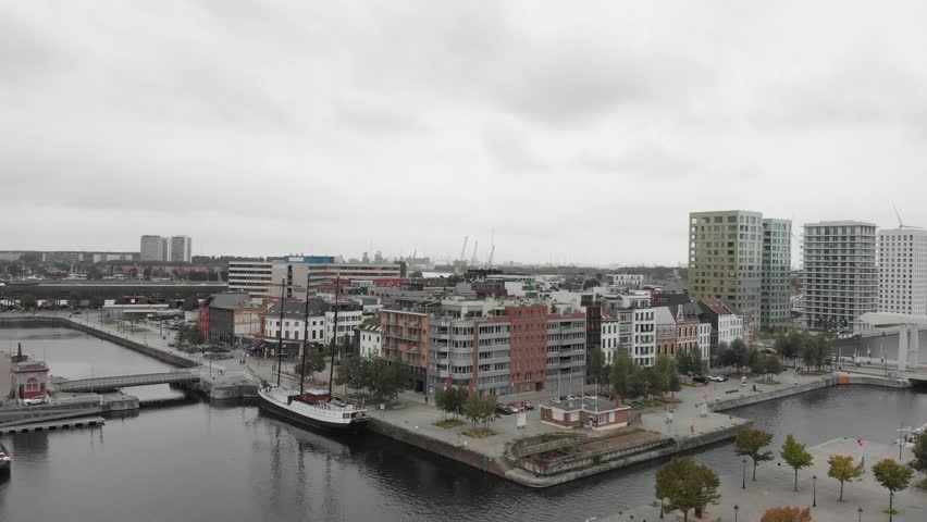 Aerial view of Bonapartedok in Antwerp, Belgium with boats and yachts on a cloudy and foggy day.