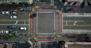 San Francisco, USA - 21 January 2018: Top view at street crossing with traffic, walking people and a rainbow crosswalk in Castro District. Aerial video recording. Editorial.