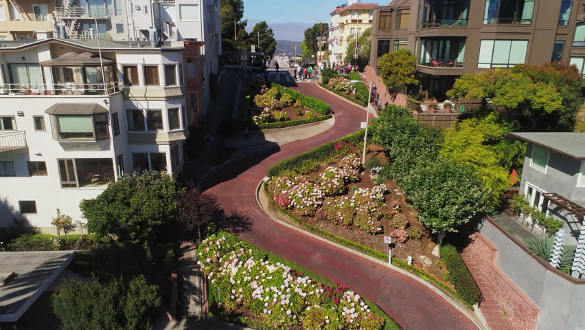 San Francisco, California, US / 09.09.2018 / Lombard Street is famous for a steep, one-block section with eight hairpin turns / Aerial Footage Prores HQ Royalty-Free Stock Footage #1017274519