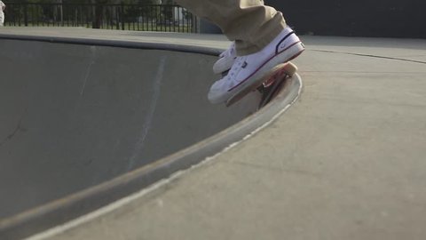 Skateboarder grinding on a halfpipe.
