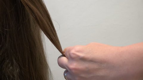 Cutting long hair, close up