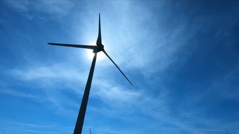 Wind energy clean fields blue sky. wind energy generator renewable turbine windmill power clean and renewable resources. Wind energy does not pollute the environment. Serial Videos-1