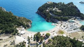 Aerial drone video of iconic Monastery of Palaiokastritsa near popular turquoise beach of Agios Spyridonas, Corfu island, Ionian, Greece