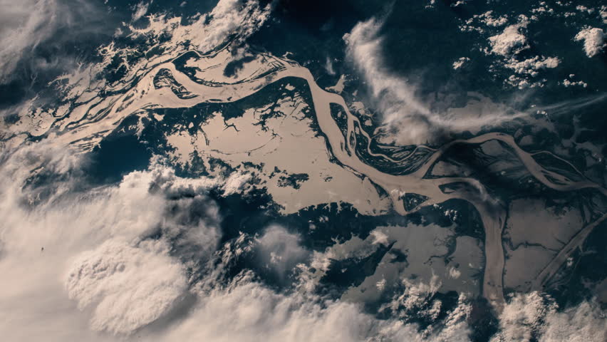 Aerial satellite view of sunset shadow on amazon river and forest animation. Contains public domain image by NASA/ESA Royalty-Free Stock Footage #1017320470