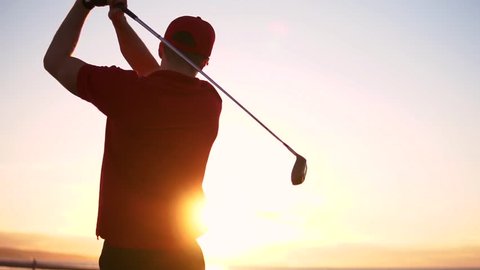 Cinematic Male Golfer At Sunset, Slow Motion Golf Swing Drive Shot.