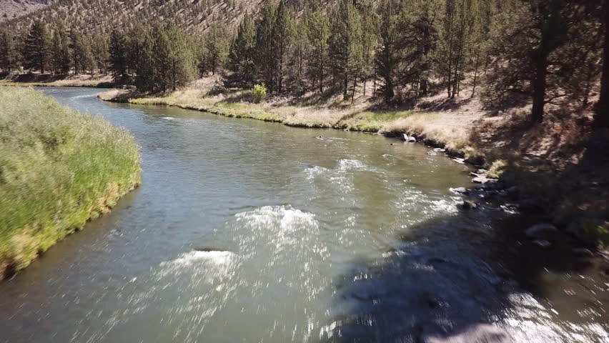 Flight in the high desert of central Oregon over premier flyfishing trout stream in the crooked river canyon