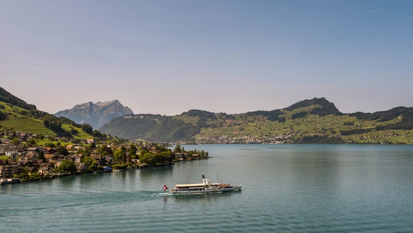 Aerial View of Small boats on the lake, in the mountains in sunny day
