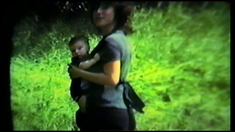 Mother with baby boy outdoors, 1970s 8mm amateur film home movie