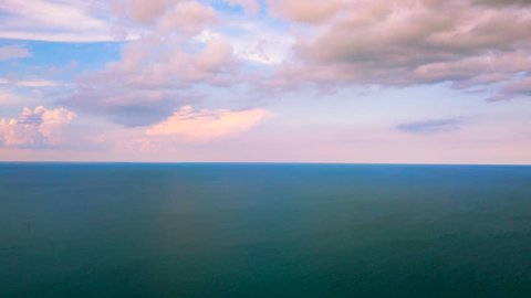 4K  Aerial Hyperlapse.Beautiful clouds over  ocean, sea surface. Morning time