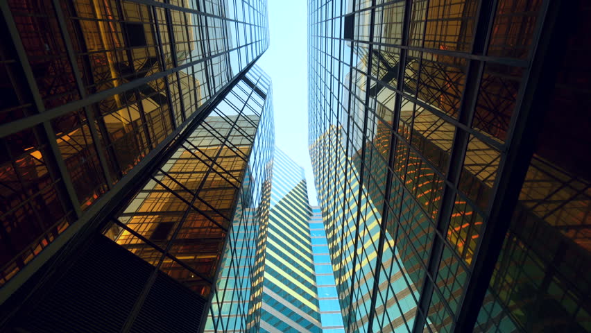 modern skyscrapers in business district against blue sky. Futuristic modern architecture building. Financial economy growth concept. Royalty-Free Stock Footage #1017357118