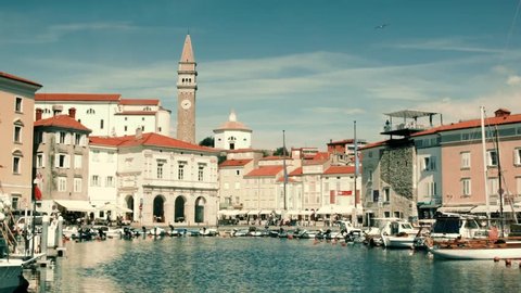 Piran, Slovenia. Summer a view of the city of piran with beautiful old buildings and central square. Marina with yachts near the beautiful old city in Europe.