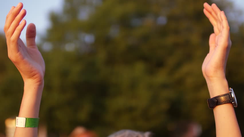 Hands clap at the concert