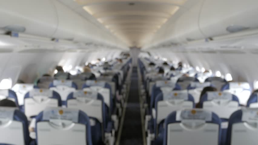 Landscape inside the plane cabin with blurred focusing while plane is cruising in the sky Royalty-Free Stock Footage #1017370192