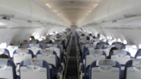 Landscape inside the plane cabin with blurred focusing while plane is cruising in the sky