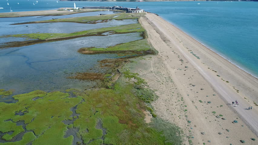 An aerial view of a rocky foot path on the beach to Hurst Castle