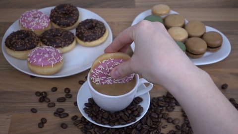 FPV of Coffee time in slow motion with macaroons and donuts 