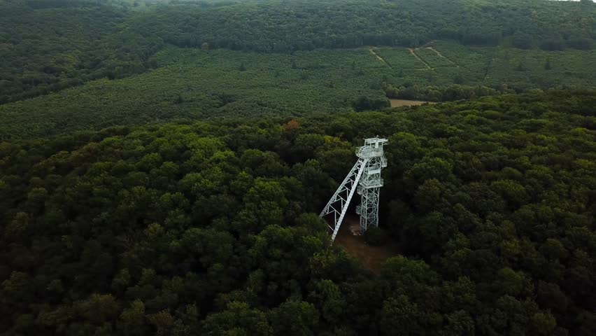 Flying close up of White Watchtower on the top of Gerecse Mountains in Hungary
