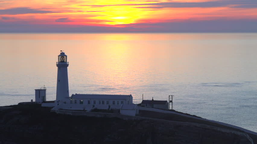 beautiful sunset over South Stack light house Anglesey slow time lapse