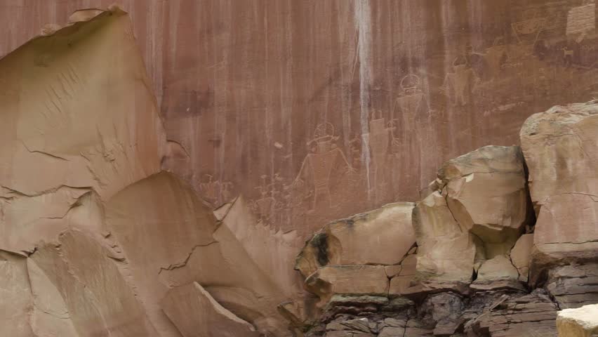 Native American Petroglyphs on red rock inside of the Capital Reef National Park in Southern Utah, USA.