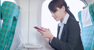 business woman work with smart phone and laptop in the train