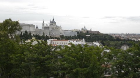 Views from Debod's park in Madrid on a cloudy day. You can see the Madrid's Royal Palace and the Almudena Cathedral