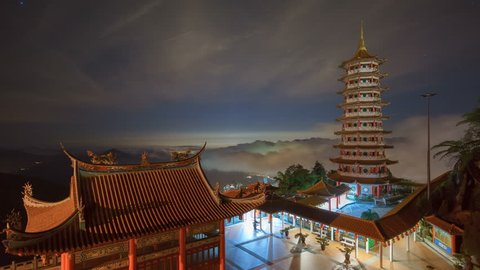 Night timelapse at Chin Swee Temple, Malaysia with rolling fogs in the background. 4,600 feet above sea level, the temple is the one of popular tourism spot near Genting Highland, Malaysa.