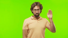 young bearded silly man trying to listen against chroma key editable background. ready to cut out the person.