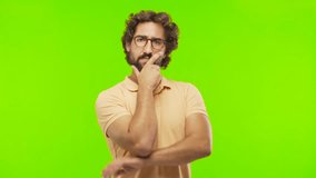 young bearded silly man doubting or realizing against chroma key editable background. ready to cut out the person.