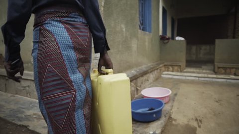 African woman with water container