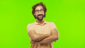 young bearded silly man smiling against chroma key editable background. ready to cut out the person.