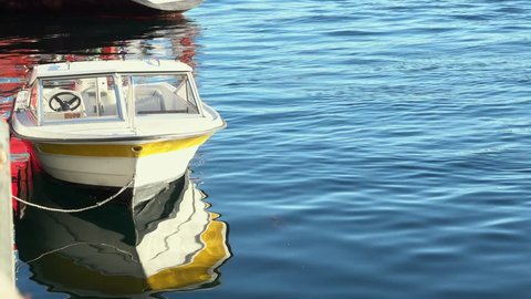 Speed boat parking in slow ocean with shadow reflex 4k
