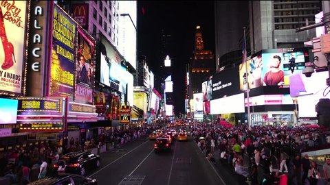 NEW YORK CITY, USA - SEPT 22, 2018: Aerial low angle moving drone shot of Times Square at night with advertisement skyscrapers in NYC  . NYC is a popular tourist travel destination.