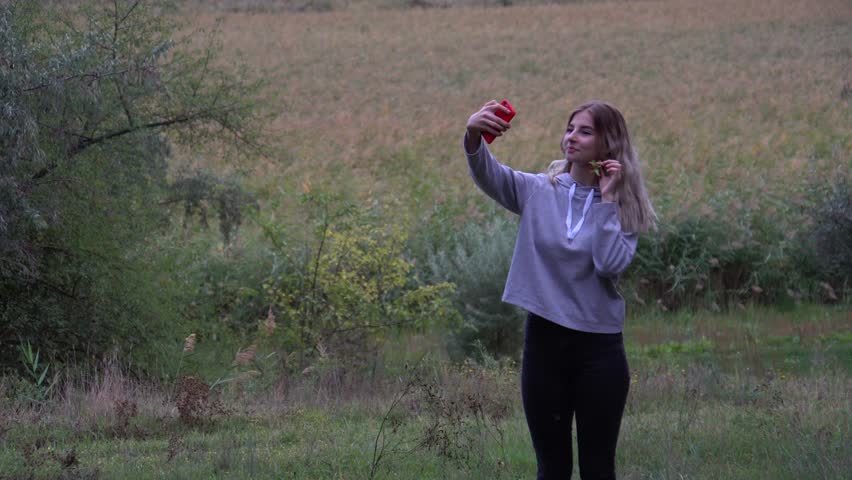 Walk in the woods. The girl walks through the woods. Wild nature. autumn nature. 