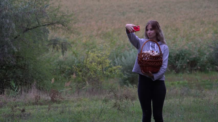 Walk in the woods. The girl walks through the woods. Wild nature. autumn nature. beautiful girl taking a selfie