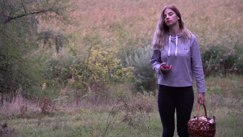 Walk in the woods. The girl walks through the woods. Wild nature. autumn nature. beautiful girl taking a selfie